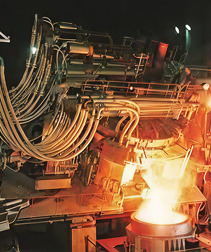 Molten metal pouring in a factory with complex pipe setup