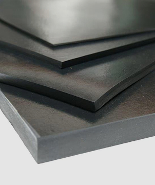 Stacked black rubber sheets in perspective